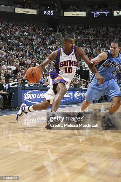 Leandro Barbosa of the Phoenix Suns drives to the basket against Deron Williams of the Utah Jazz on November 18, 2006 at the Delta Center in Salt...