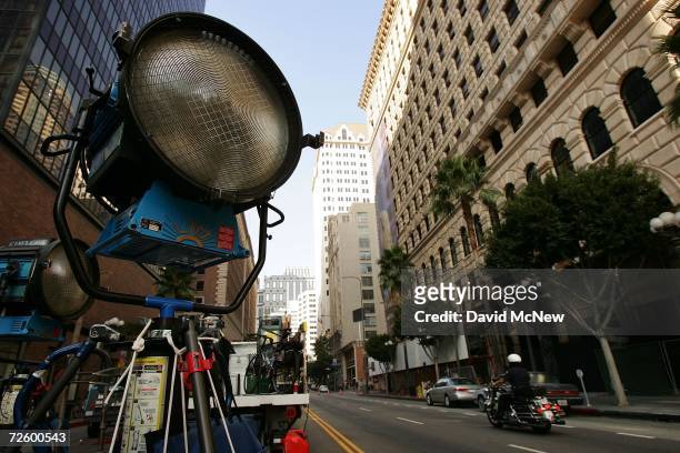 Police officer passes lights used in an auto insurance commercial on-location downtown on November 18, 2006 in Los Angeles, California. A report...