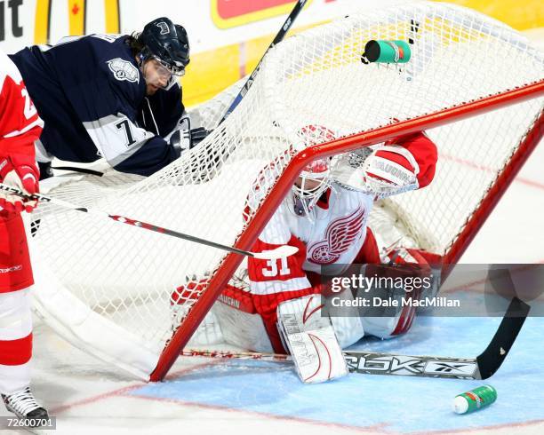 Petr Sykora of the Edmonton Oilers tips the net on top of Joey MacDonald of the Detroit Red Wings at the Rexall Place on November 18, 2006 in...