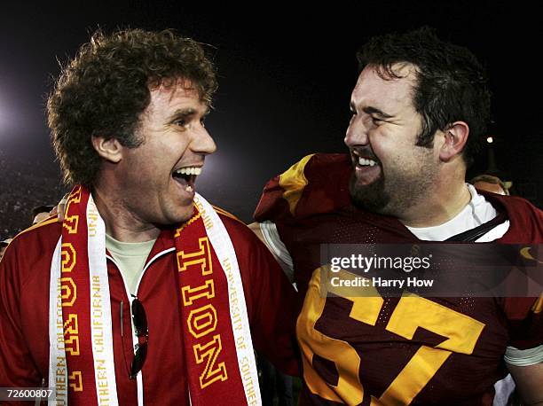 Actor Will Ferrell and Ryan Kalil of the USC Trojans celebrate a 23-9 win over the California Golden Bears during the game at the Los Angeles...