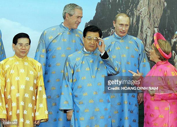 Chile President Michelle Bachelet gestures to Russian President Vladimir Putin , Chinese President Hu Jintao and US President George W. Bush while...