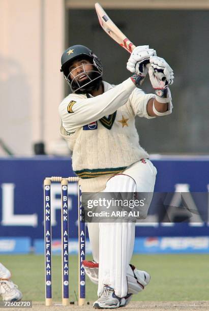 Pakistani batsman Mohammad Yousuf watches his hit during the first day of the second Test match between Pakistan and West Indies at The Multan...