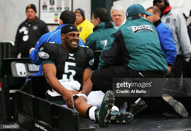 Donovan McNabb of the Philadelphia Eagles is carted off the field after injuring his right knee in the second quarter against the Tennessee Titans on...