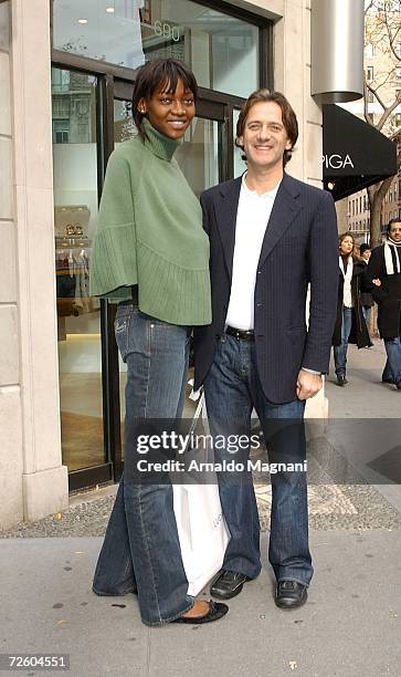 Model Oluchi Onweagba and designer Luca Orlandi pose in front of his store ''Luca Luca'' on Madison Avenue on November 19, 2006 in New York City.