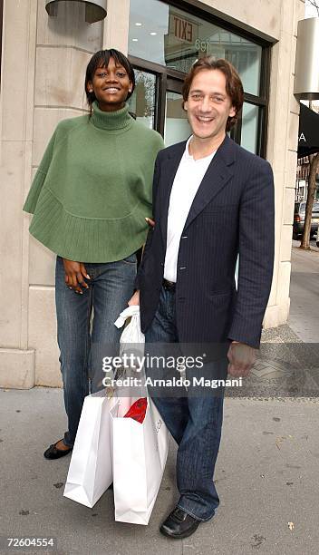 Model Oluchi Onweagba and designer Luca Orlandi pose in front of his store ''Luca Luca'' on Madison Avenue on November 19, 2006 in New York City.