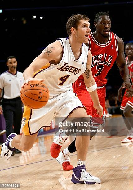 Luke Walton of the Los Angeles Lakers drives to the basket against Ben Wallace of the Chicago Bulls on November 19, 2006 at Staples Center in Los...