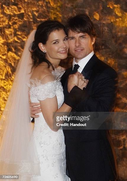 In this handout photo provided by Robert Evans, Tom Cruise and Katie Holmes pose together at Castello Odescalchi on their wedding day November 18,...