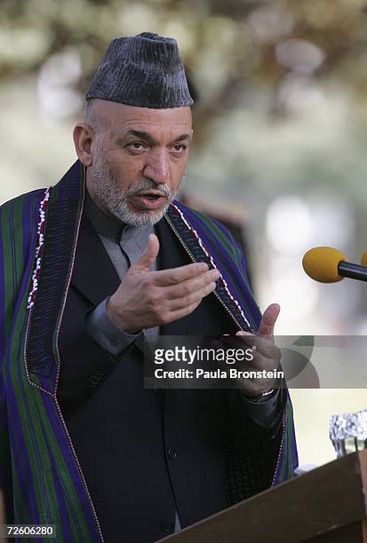 Afgan President Hamid Karzai speaks to the press during a press conference with British Prime Minister Tony Blair at the presidential palace after...