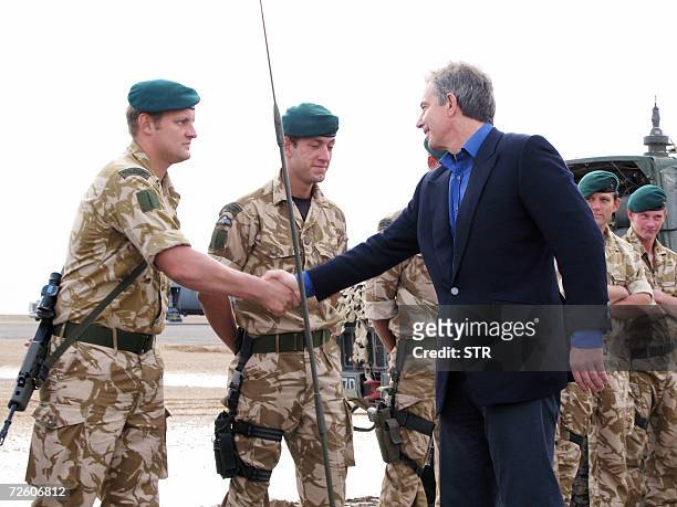 British Prime Minister Tony Blair shakes hands with a British soldier during a visit at the southern Camp Bastion base in the southern Afghan Helmand...