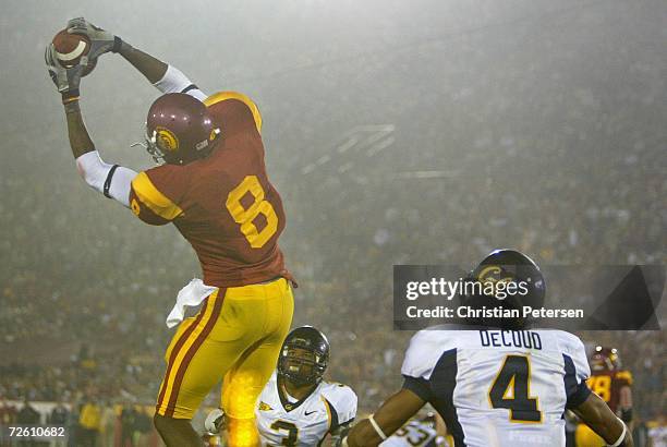 Dwayne Jarrett of the USC Trojans makes a leaping catch over Thomas DeCoud of the California Golden Bears during the game held on November 18, 2006...