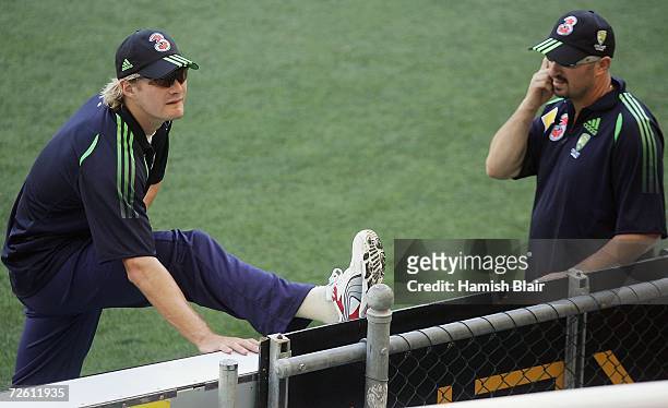 Shane Watson tests his hamstring with team physio Alex Kountouri during the Australia nets session at the Gabba on November 21, 2006 in Brisbane,...