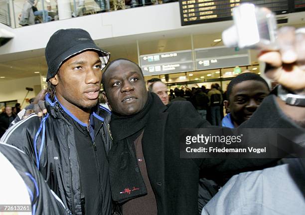 Didier Drogba poses with a fan as Chelsea FC arrive at Bremen airport on November 21, 2006 in Bremen, Germany. Chelsea will play against Werder...
