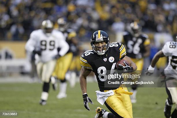 Wide receiver Hines Ward of the Pittsburgh Steelers runs with the football after catching a pass against the New Orleans Saints at Heinz Field on...