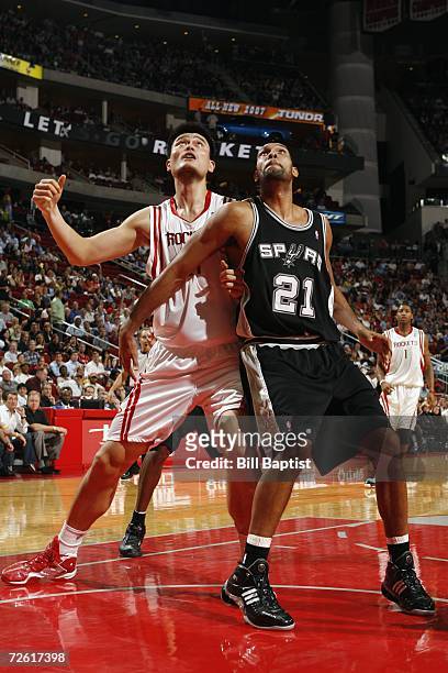 Tim Duncan of the San Antonio Spurs battles for position with Yao Ming of the Houston Rockets during a game at the Toyota Center on November 14, 2006...
