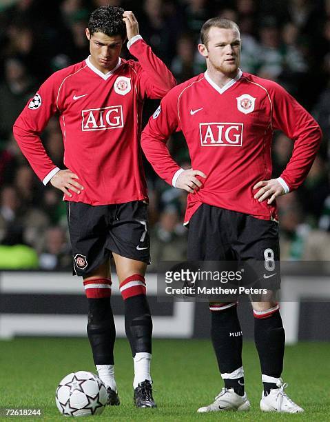 Cristiano Ronaldo and Wayne Rooney of Manchester United show their disappointment after conceding a goal during the UEFA Champions League match...