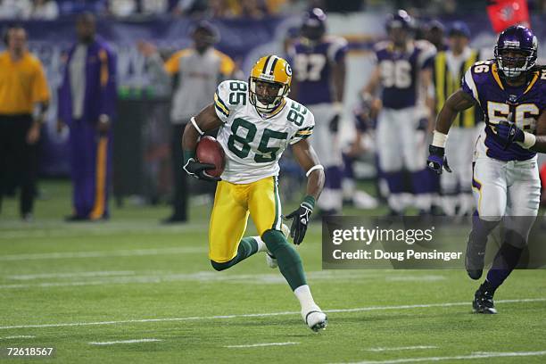 Wide receiver Greg Jennings of the Green Bay Packers runs with the ball during the game against the Minnesota Vikings on November 12, 2006 at the...