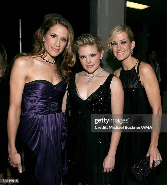 Musicians Emily Robinson, Natalie Maines and Martie Maguire of The Dixie Chicks pose backstage at the 2006 American Music Awards held at the Shrine...