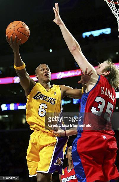 Maurice Evans of the Los Angeles Lakers lays the ball up against Chris Kaman of the Los Angeles Clippers November 21, 2006 at Staples Center in Los...