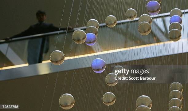 Man looks out over the specially commissioned sculpture called 'The Source', by artists Greyworld at the London Stock Exchange on November 22, 2006...