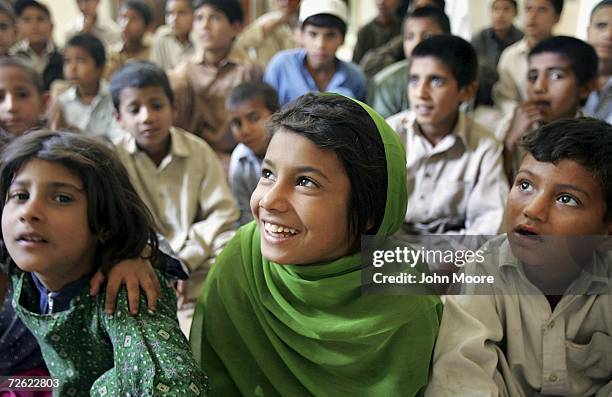 Street children listen during an AIDS awareness class on April 21, 2006 at a daytime shelter in Peshawar, Pakistan. Street children, often exploited...