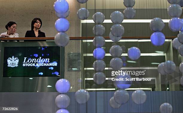 People look out over the specially commissioned sculpture called 'The Source', by artists Greyworld at the London Stock Exchange on November 22, 2006...