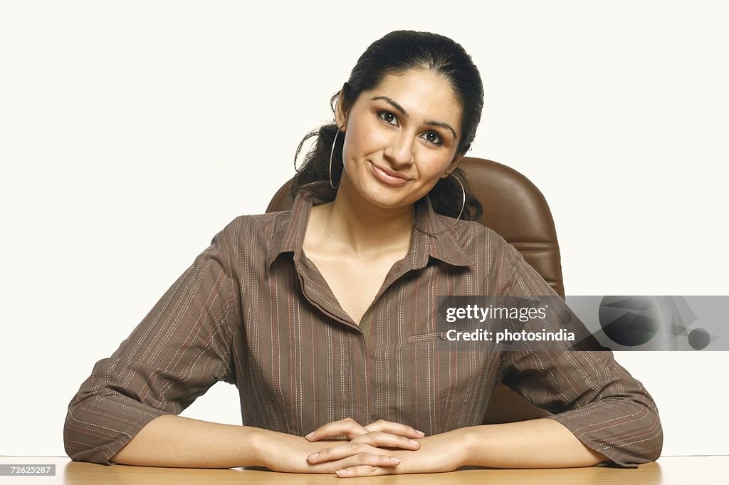 Portrait of a businesswoman with his hands clasped