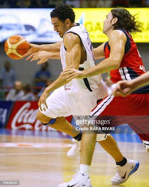 Tau Baskonia's Argentinian Luis Scola tries to stop Climamio Bolonia's David Bluthenthal during their Euroleague group A basketball match at Fernando...