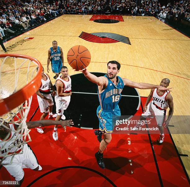 Peja Stojakovic of the New Orleans/Oklahoma City Hornets shoots a layup during a game against the Portland Trail Blazers at The Rose Garden on...