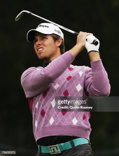 Aaron Baddeley of Australia hits his approach shot during the first round of the 2006 Mastercard Masters at Huntingdale Golf Club on November 23,...