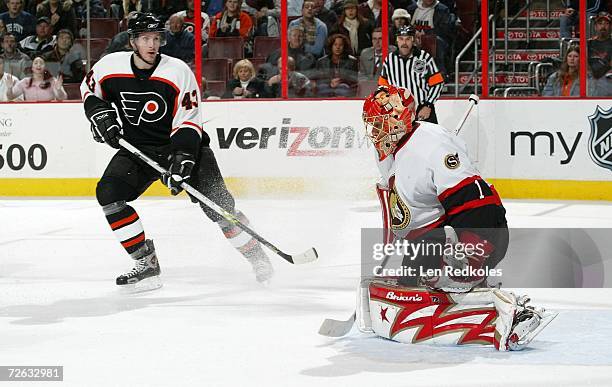Lars Johnson of the Philadelphia Flyers takes a shot on goal against Ray Emery of the Ottawa Senators on November 22, 2006 at the Wachovia Center in...