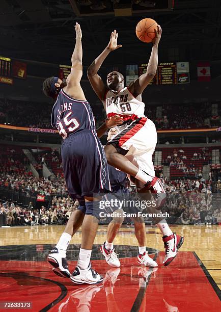 Zach Randolph of the Portland Trail Blazers shoots against Jason Collins of the New Jersey Nets November 22, 2006 at the Rose Garden Arena in...