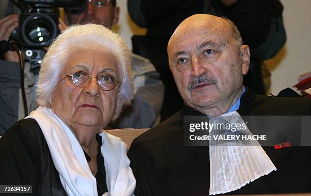 Renee Le Roux talks with her lawyer Georges Kiejman 23 November 2006 at the courthouse of the French Riviera city of Nice, where Jean-Maurice...