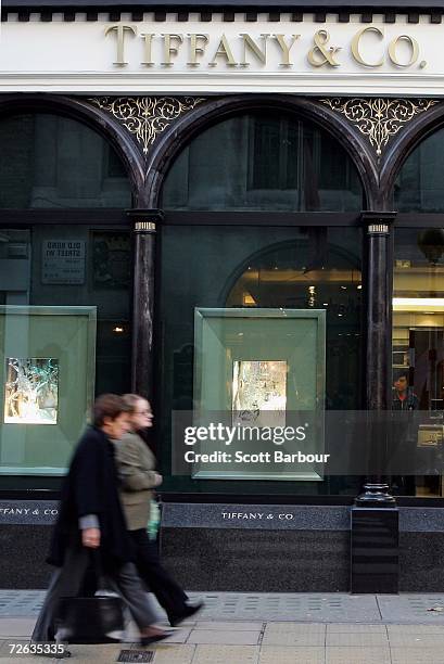 People walk past the Tiffany & Co. Store in Bond Street on November 23, 2006 in London, England. The price of Gold in London steadied in quiet trade...