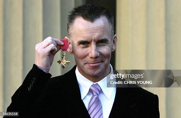 United Kingdom: Britain's Chef Gary Rhodes shows off his Order of the British Empire awarded for services to the hospitality industry in Buckingham...