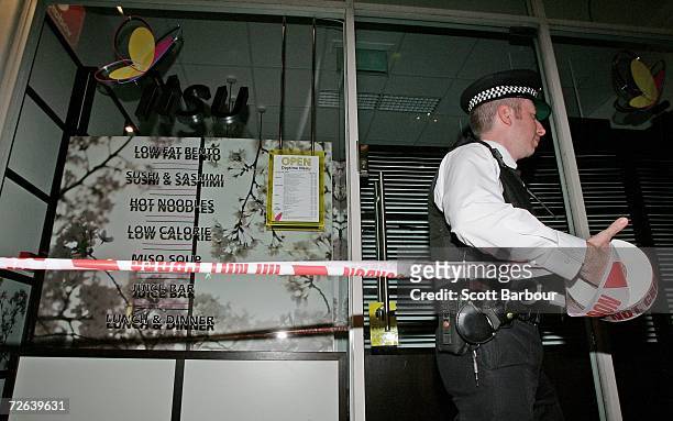 British police officer stands guard outside of Itsu restaurant on November 24, 2006 in London, England. Former Russian spy, Alexander Litvinenko has...