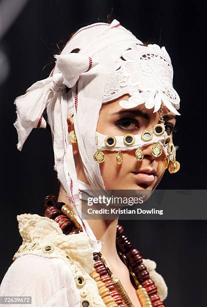Model walks the catwalk wearing an outfit by designer Tangoo on the second day of Malaysian-International Fashion Week at the Kuala Lumpur Convention...