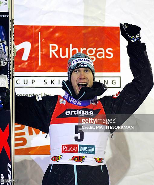 Finland's Arttu Lappi celebrates on the podium after winning the season's first Ski jumping World Cup event in Ruka, Kuusamo, 24 November 2006. The...