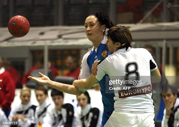 Russia`s Ludmila Postnova is challenged by German Anne M?ller during the match opposing Russia vs Germany in a four nation handball tournament in...