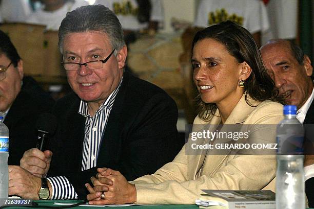 Belgium Foreign Affairs Minister Karel de Gucht and his Colombian counterpart Maria Consuelo Araujo take part in a meeting with the community of...