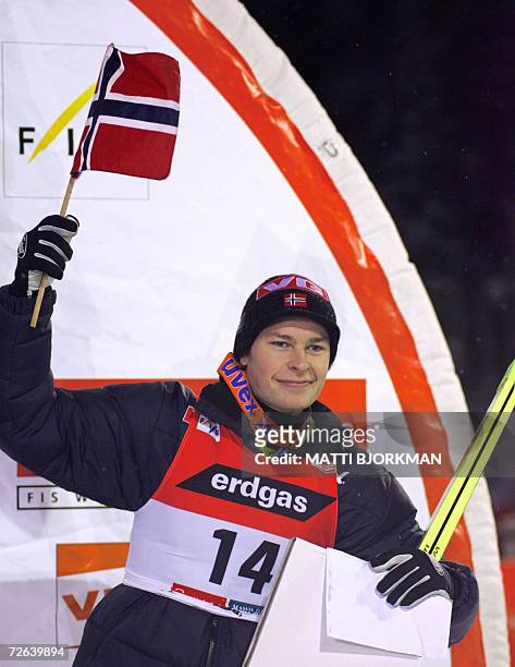 Norway's Anders Jacobsen celebrates on the podium after placing third in the season's first Ski jumping World Cup event in Ruka, Kuusamo, 24 November...