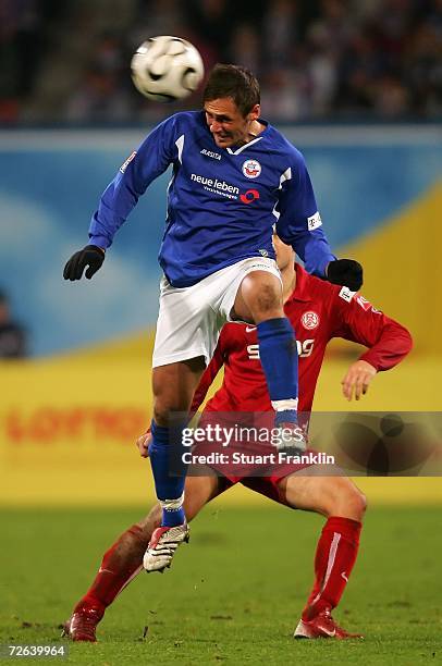 Marcel Schied of Rostock challenges fro the ball with Pascal Bieler of Essen during the Second Bundesliga match between Hansa Rostock and Rot Weiss...
