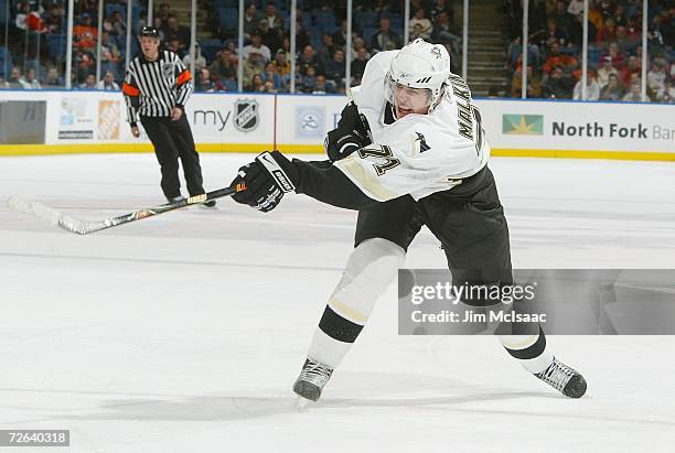 Evgeni Malkin of the Pittsburgh Penguins follows through on his third period goal against the New York Islanders at Nassau Coliseum November 24, 2006...