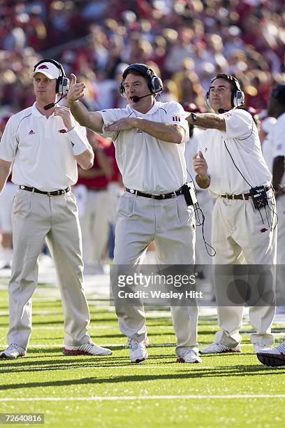 Arkansas Razorback Head Coach Houston Nutt signals to his team in a game against the LSU Tigers at War Memorial Stadium on November 24, 2006 in...