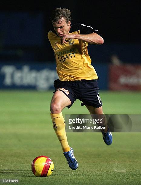 Adam Kwasnik of the Central Coast Mariners runs with the ball during the round fourteen Hyundai A-League match between the Central Coast Mariners and...