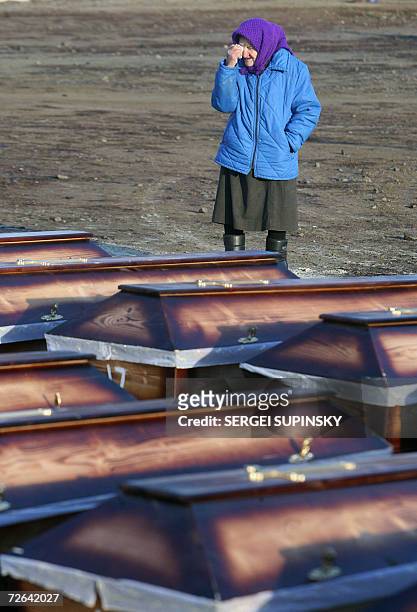 An woman cries in front of coffins 25 November 2006 before a funeral ceremony during a day of remembrance for up to 10 million people who starved to...