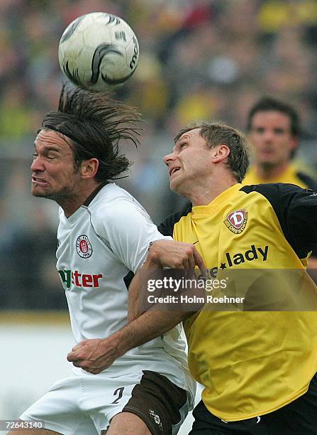 Florian Lechner of St. Pauli and Ivo Ulich of Dynamo fight for the ball during the Third League match between Dynamo Dresden and FC St.Pauli at the...