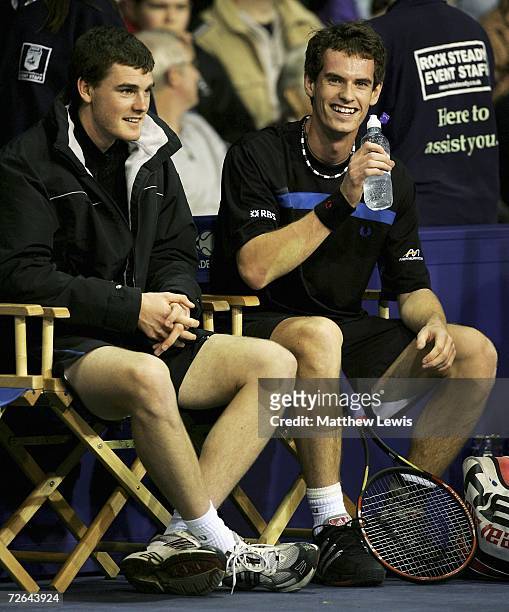Andy Murray of Scotland laughs with brother Jamie Murray during the game against Greg Rusedski of England during the Aberdeen Tennis Cup at The...