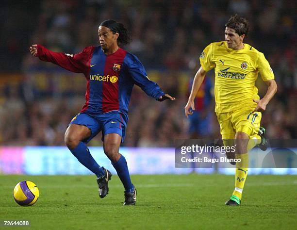 Ronaldinho of Barcelona and Ruben Garcia Cani of Villarreal in action during the match between FC Barcelona and Villarreal, of La Liga, on November...