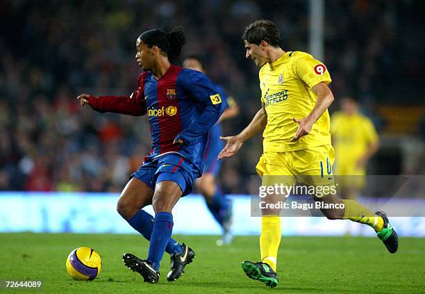 Ronaldinho of Barcelona and Ruben Garcia Cani of Villarreal in action during the match between FC Barcelona and Villarreal, of La Liga, on November...