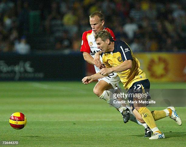 Stewart Petrie of the Mariners and Richie Alagaich of Adelaide compete for the ball during the round fourteen Hyundai A-League match between the...